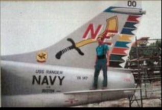 Man on ladder working on A7 Corsair number 400