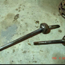 Halftrack axle shafts laid out on floor