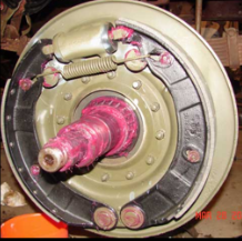 Halftrack brake drum assembly with pink grease closeup