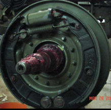 Halftrack brake drum with red grease on axle shaft