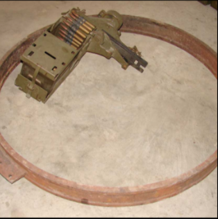 Machine gun ring mount with ammo on floor collecting parts