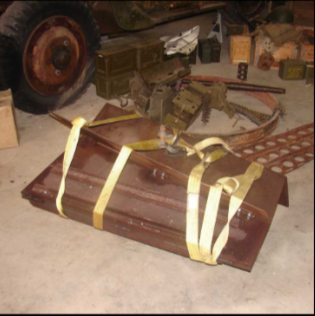Halftrack ramp panel strapped with yellow straps collecting parts