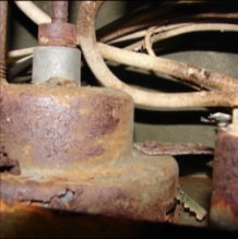 Corroded wiring and dash hardware close-up