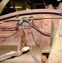 Frame bracket with wiring harness close-up