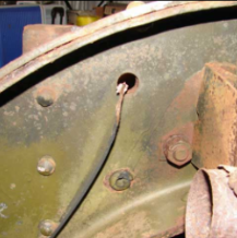 Curved frame section with bolt and cable